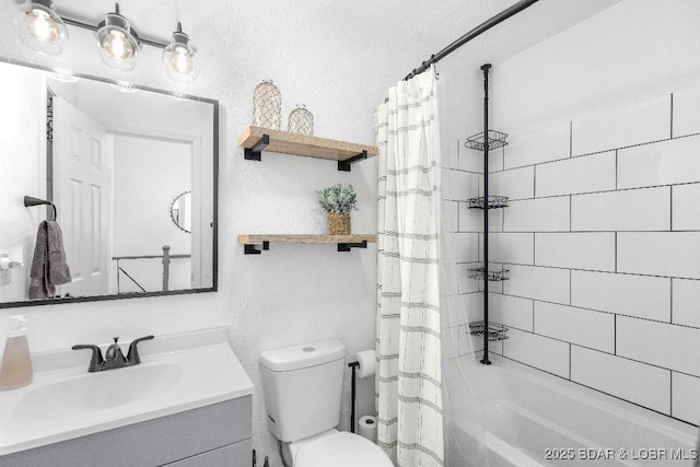 bathroom featuring toilet, shower / bath combo, and vanity