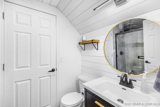 bathroom with toilet, wood ceiling, a shower stall, vanity, and lofted ceiling