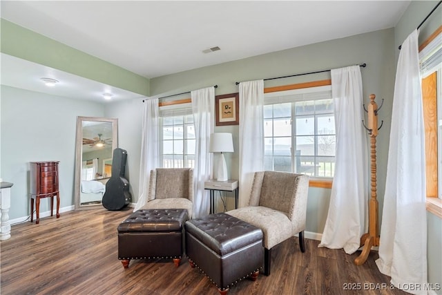 14671 Old Marvin Rd, Versailles, MO 65084 - living area featuring wood finished floors, baseboards, and visible vents
