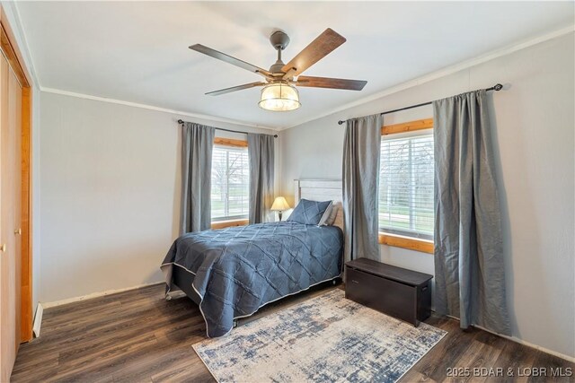 14671 Old Marvin Rd, Versailles, MO 65084 - bedroom with wood finished floors, multiple windows, and ornamental molding