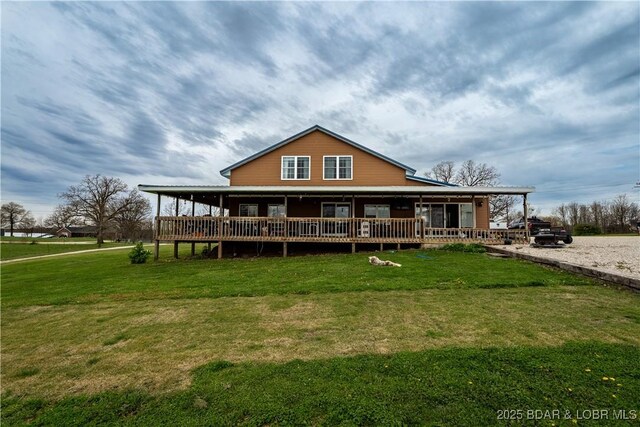 14671 Old Marvin Rd, Versailles, MO 65084 - rear view of property featuring a lawn