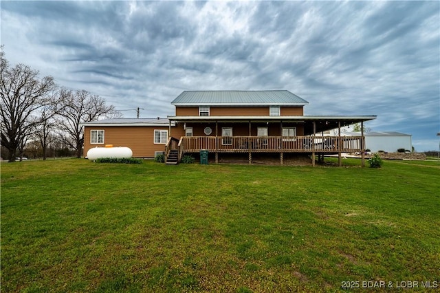 14671 Old Marvin Rd, Versailles, MO 65084 - rear view of house with metal roof and a lawn