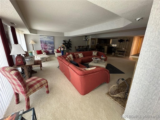 429-1D Racquet Club Dr Unit 1D, Four Seasons, MO 65049 - carpeted living room featuring visible vents, a textured ceiling, and a raised ceiling