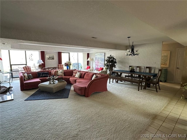 429-1D Racquet Club Dr Unit 1D, Four Seasons, MO 65049 - tiled living area featuring a textured ceiling, a chandelier, and a healthy amount of sunlight