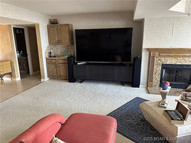 429-1D Racquet Club Dr Unit 1D, Four Seasons, MO 65049 - living area with light carpet, a high end fireplace, light tile patterned floors, and a textured wall