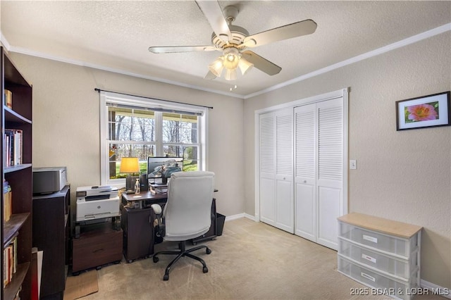 office with crown molding, a ceiling fan, a textured ceiling, and light colored carpet