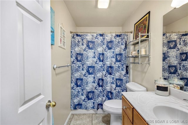 bathroom featuring vanity, tile patterned floors, toilet, and curtained shower