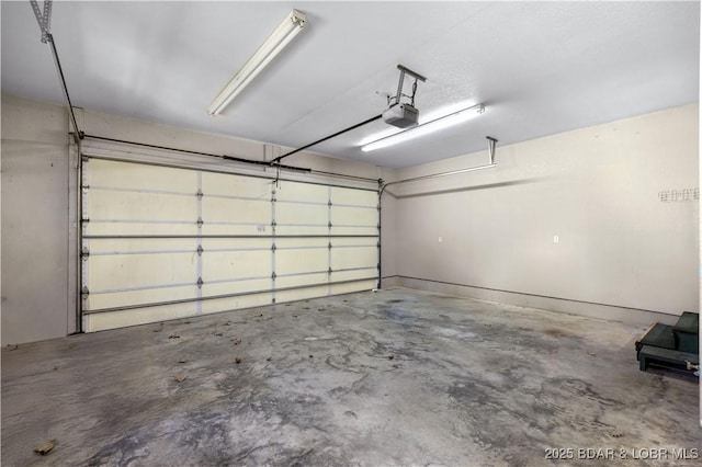 garage featuring a garage door opener