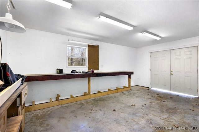 garage with a workshop area