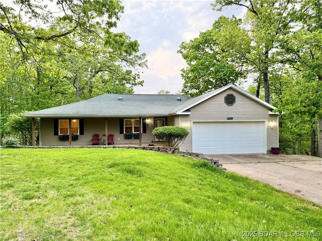 ranch-style house featuring an attached garage, concrete driveway, a porch, and a front lawn