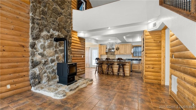 15 Rose Wind Ln, Brumley, MO 65017 - living room featuring rustic walls and a wood stove