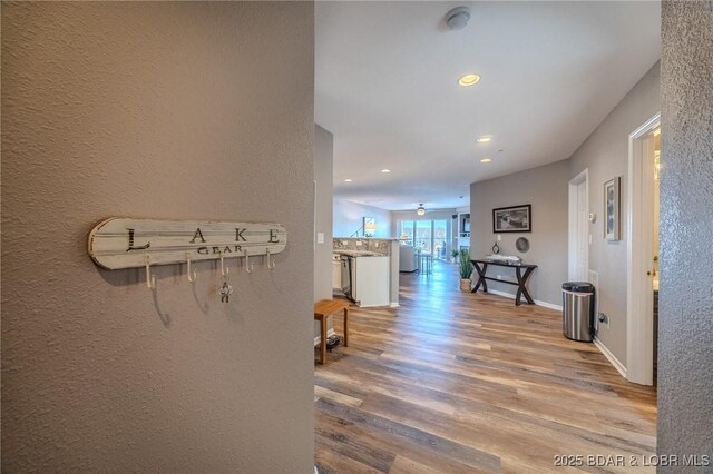 1359 Seascape Ln Unit A-501, Osage Beach, MO 65065 - hall with wood finished floors, recessed lighting, and baseboards