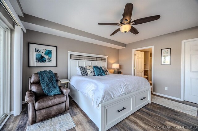 1359 Seascape Ln Unit A-501, Osage Beach, MO 65065 - bedroom with dark wood-type flooring, ensuite bathroom, baseboards, and ceiling fan