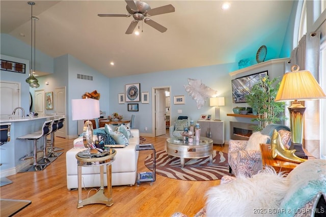 5218 Big Ship St, Osage Beach, MO 65065 - living area with ceiling fan, light wood finished floors, high vaulted ceiling, and recessed lighting