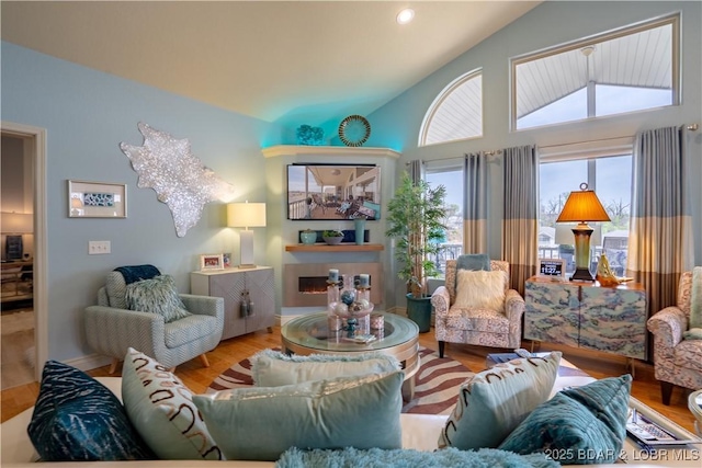 5218 Big Ship St, Osage Beach, MO 65065 - living room with lofted ceiling, wood finished floors, and recessed lighting