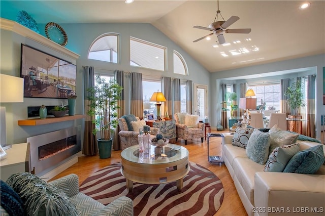 5218 Big Ship St, Osage Beach, MO 65065 - living room featuring high vaulted ceiling, recessed lighting, a ceiling fan, and wood finished floors