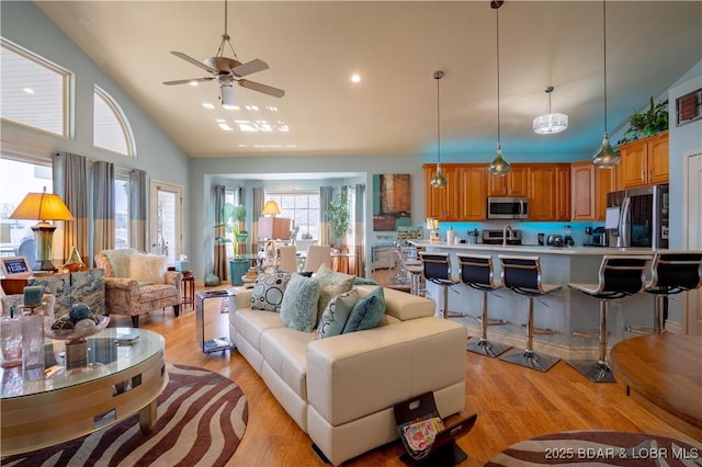 5218 Big Ship St, Osage Beach, MO 65065 - living room featuring light wood-style floors, high vaulted ceiling, a ceiling fan, and recessed lighting