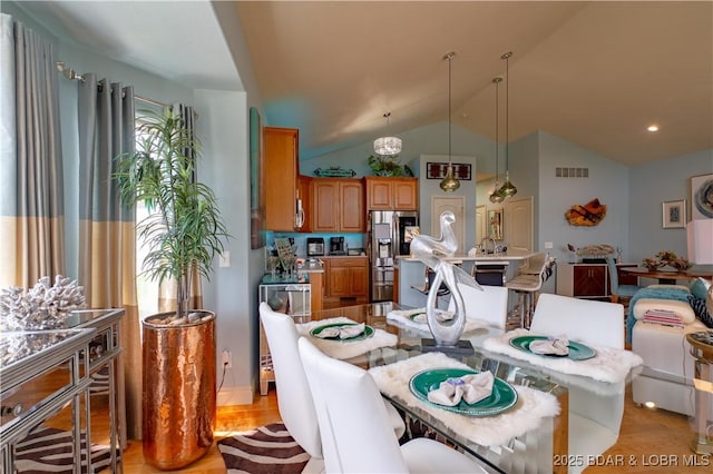 5218 Big Ship St, Osage Beach, MO 65065 - dining room featuring visible vents and lofted ceiling