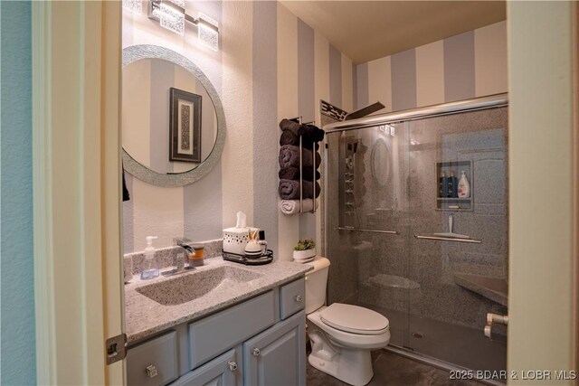 5218 Big Ship St, Osage Beach, MO 65065 - full bathroom with toilet, a shower stall, and vanity