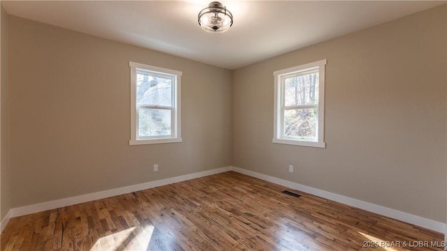 1129 Ginger Rd, Lake Ozark, MO 65049 - unfurnished room featuring wood finished floors