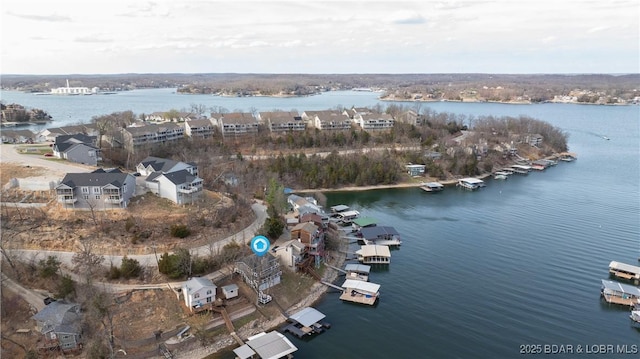 aerial view of property's location with a nearby body of water