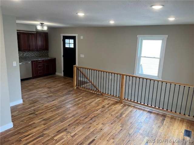 1129 Ginger Rd, Lake Ozark, MO 65049 - kitchen with dishwasher, wood finished floors, backsplash, dark brown cabinetry, and recessed lighting