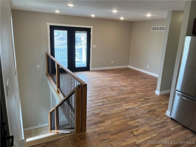1129 Ginger Rd, Lake Ozark, MO 65049 - entryway with wood finished floors, french doors, and recessed lighting
