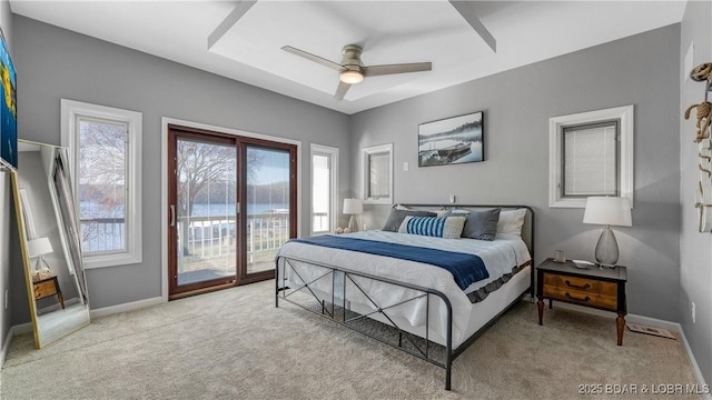 carpeted bedroom featuring ceiling fan, baseboards, access to outside, and multiple windows