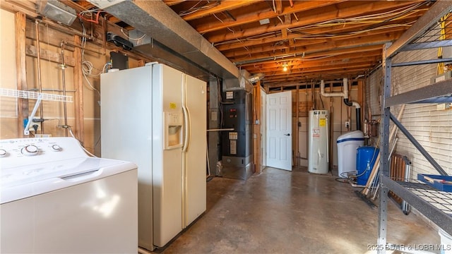 washroom featuring water heater, laundry area, heating unit, and washer / clothes dryer