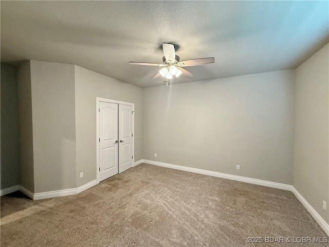 245 Davis Dr, Holts Summit, MO 65043 - carpeted spare room featuring baseboards and ceiling fan