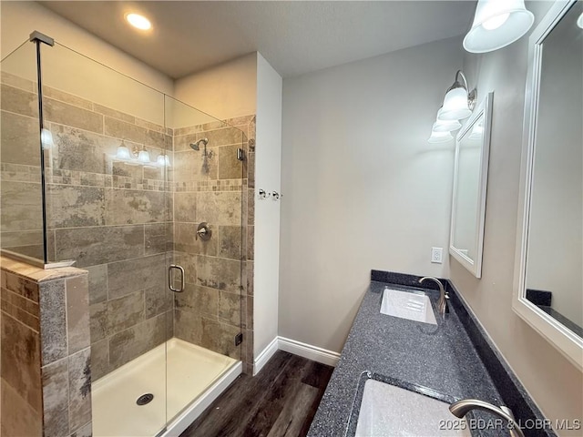 245 Davis Dr, Holts Summit, MO 65043 - bathroom featuring a shower stall, wood finished floors, vanity, baseboards, and recessed lighting