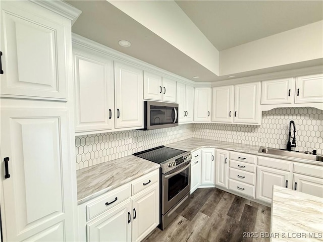 245 Davis Dr, Holts Summit, MO 65043 - kitchen featuring white cabinets, tasteful backsplash, stainless steel appliances, and a sink