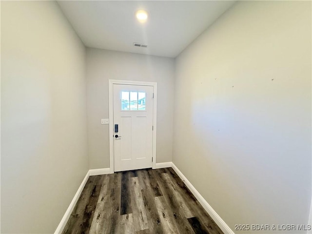 245 Davis Dr, Holts Summit, MO 65043 - doorway to outside featuring baseboards, visible vents, and dark wood-style flooring
