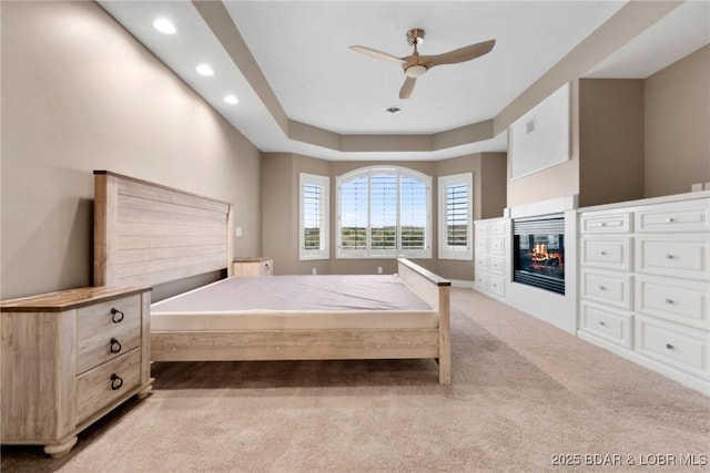275 Waterford Ter, Sunrise Beach, MO 65079 - bedroom with a glass covered fireplace, ceiling fan, carpet flooring, and recessed lighting