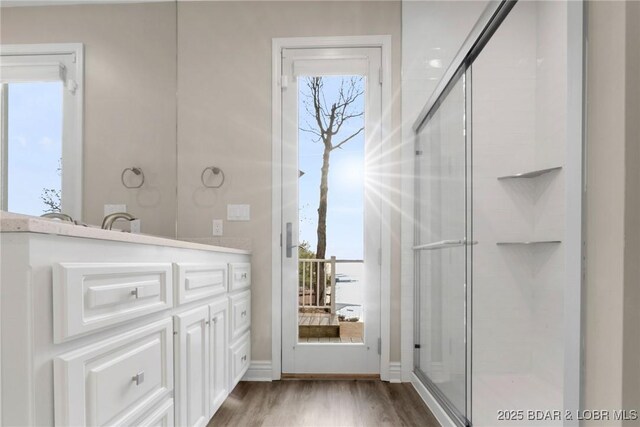 275 Waterford Ter, Sunrise Beach, MO 65079 - bathroom featuring an enclosed shower, vanity, and wood finished floors