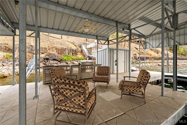 275 Waterford Ter, Sunrise Beach, MO 65079 - view of patio featuring an outdoor structure, a grill, a ceiling fan, and a storage unit
