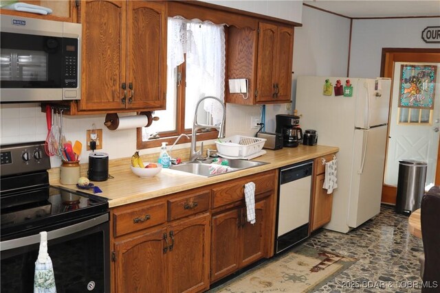 30718 Honeysuckle Rd, Gravois Mills, MO 65037 - kitchen with white appliances, tasteful backsplash, light countertops, and brown cabinets