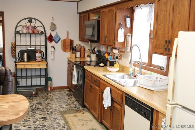 30718 Honeysuckle Rd, Gravois Mills, MO 65037 - kitchen featuring white appliances, light countertops, and healthy amount of natural light