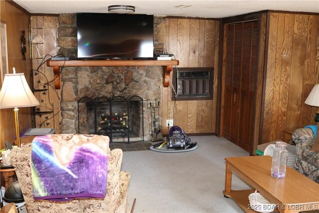 30718 Honeysuckle Rd, Gravois Mills, MO 65037 - living room with wood walls, an AC wall unit, carpet floors, and a stone fireplace