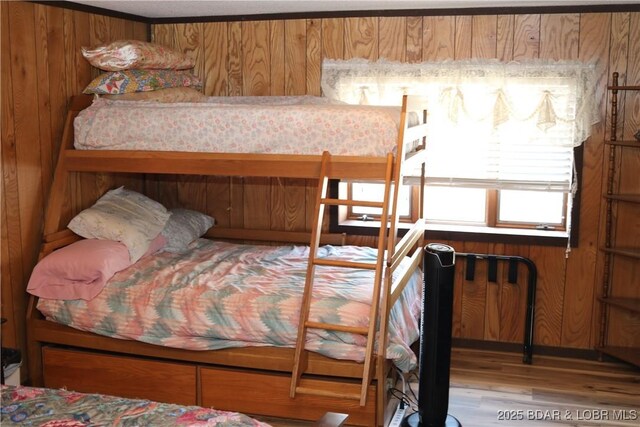 30718 Honeysuckle Rd, Gravois Mills, MO 65037 - bedroom featuring wood finished floors and wooden walls