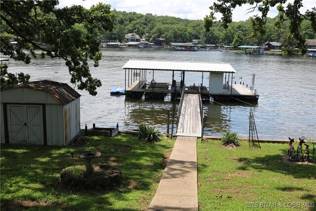 30718 Honeysuckle Rd, Gravois Mills, MO 65037 - dock area featuring a water view, boat lift, and a yard