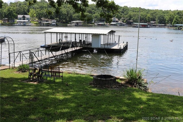 30718 Honeysuckle Rd, Gravois Mills, MO 65037 - dock with boat lift, a water view, and a yard