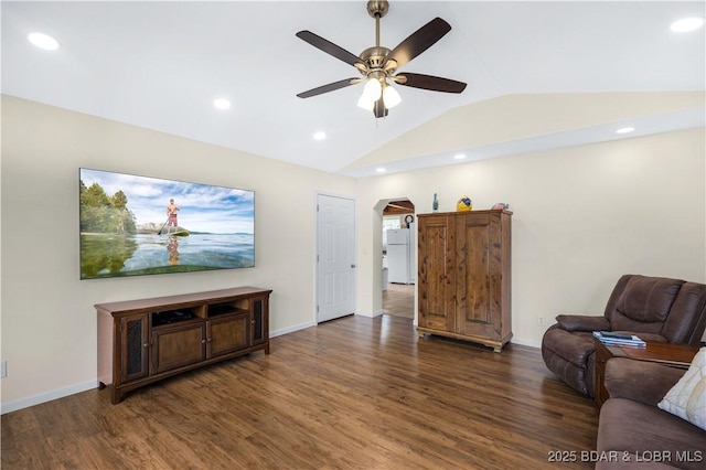 living area featuring wood finished floors, arched walkways, and recessed lighting