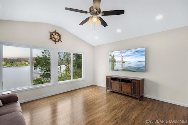 unfurnished living room featuring vaulted ceiling, a ceiling fan, wood finished floors, and recessed lighting