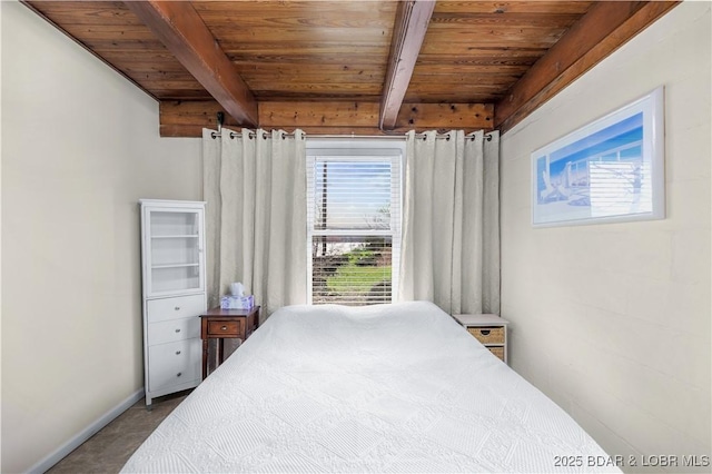 bedroom featuring wooden ceiling, baseboards, beam ceiling, and carpet floors