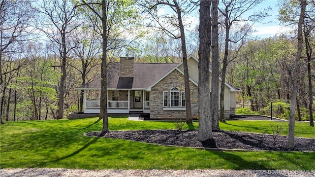 101 Cliffstone Ln, Sunrise Beach, MO 65079 - view of front of house with stone siding, a porch, a front yard, and a chimney