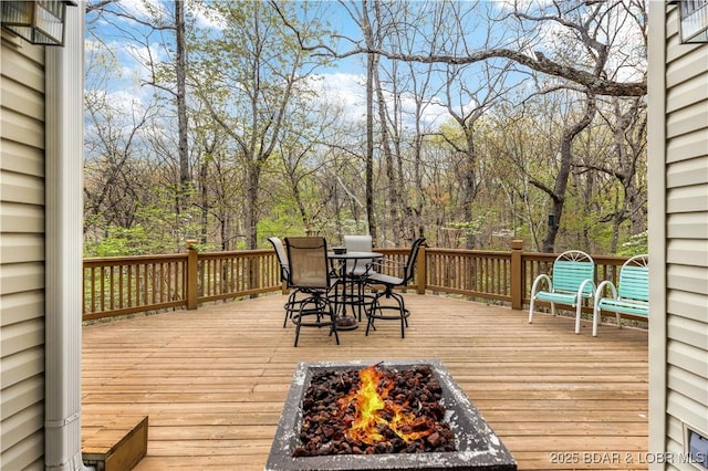101 Cliffstone Ln, Sunrise Beach, MO 65079 - wooden terrace with an outdoor fire pit and outdoor dining area