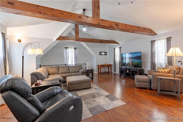 living room with lofted ceiling with beams, wood finished floors, and plenty of natural light