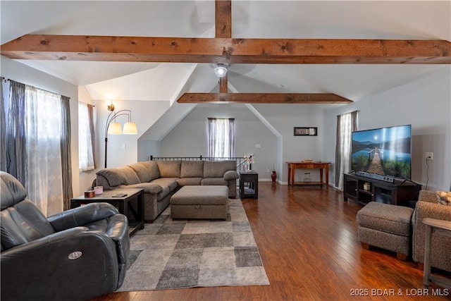 living area with wood finished floors, a ceiling fan, and lofted ceiling with beams