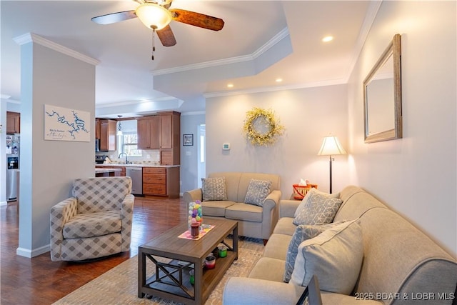 living area with baseboards, recessed lighting, a ceiling fan, dark wood-type flooring, and ornamental molding